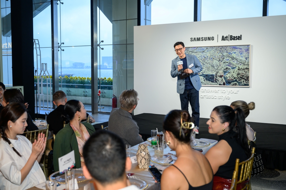 Hong addresses guests at the event