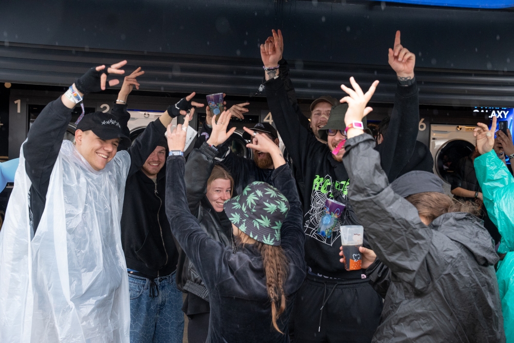 Festival-goers are keeping the energy high and dancing in line while waiting for their clothes to wash and dry.