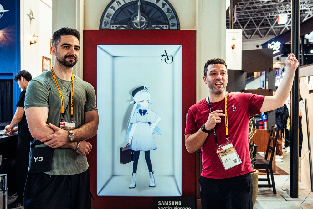 (From left) David Yousefi and Nicolas Felix experienced the striking depth of an Astrae Oratio character, delivered through Spatial Signage’s slim, space-saving design. 