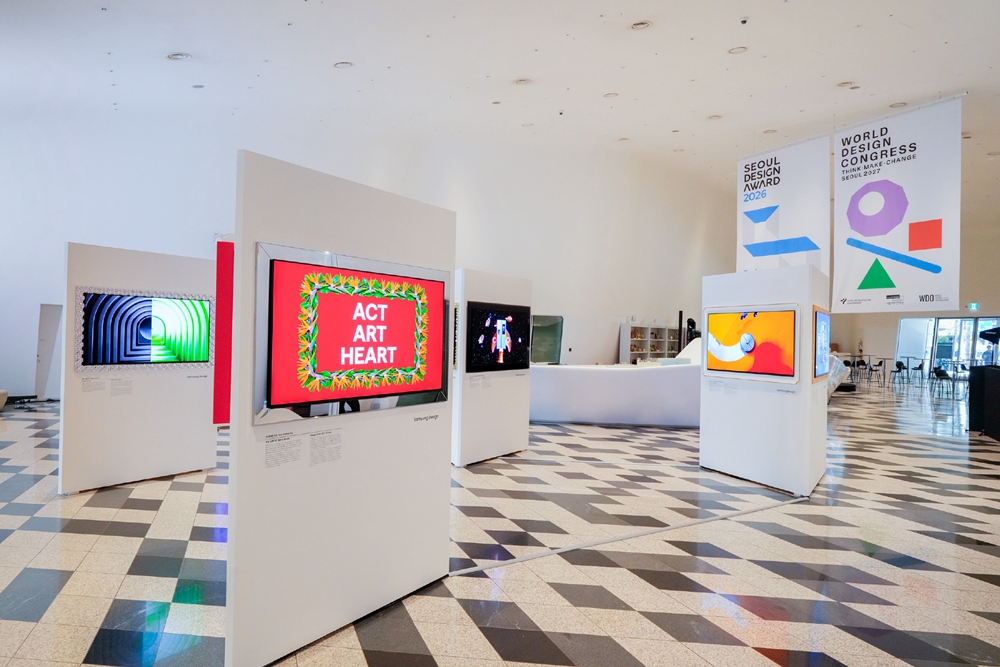 Artworks showcasing creative interpretations of Samsung products spanning mobile devices, home appliances, and TVs fill the exhibition space.