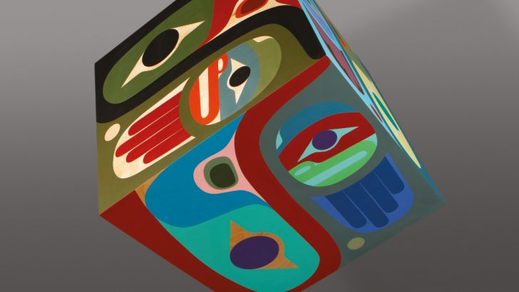 Steve-Smith-–-Dla’kwagila-Faces-of-Peace-2021-Birchwood-plywood-acrylic-paint-–-base-fir-copper-metal-Cube-Sculpture-114-x-114-cm-38000-USD-Image-courtesy-of-Angela-Bogsch.jpg
